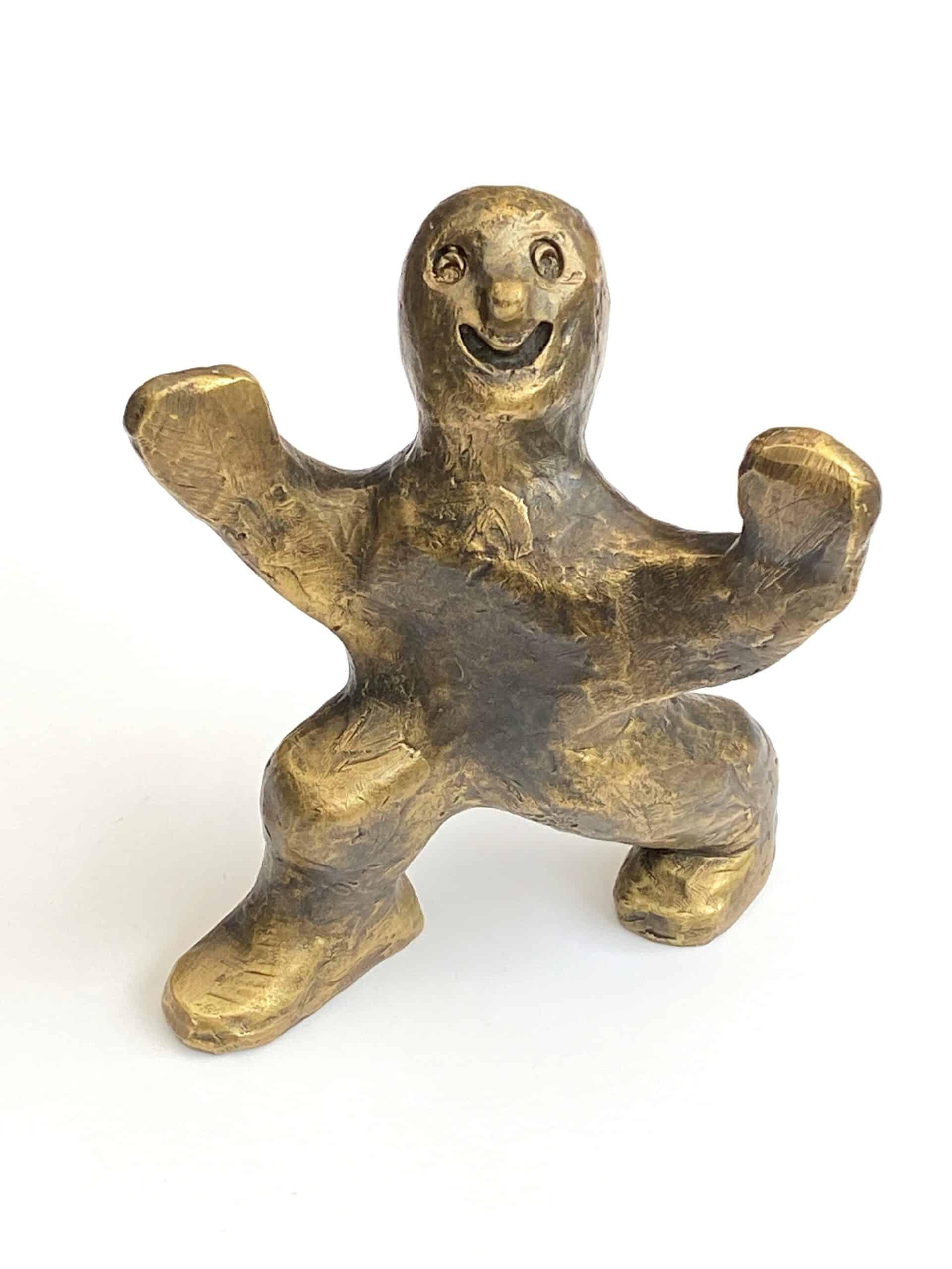 Den aktiva — bronsfigur av Palle Mernild, sprudlande energisk gestalt